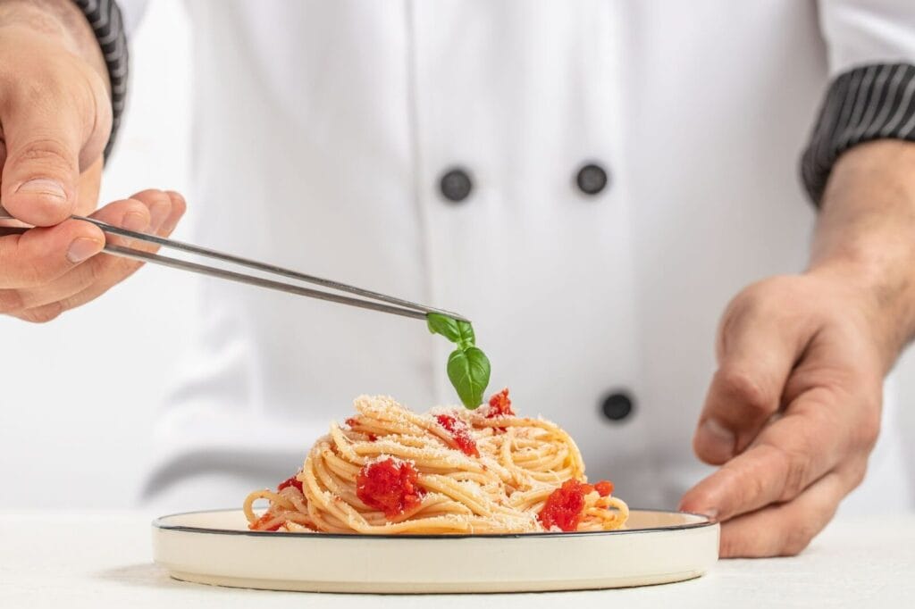  Italian Dining in Singapore With A Chef Preparing Pasta