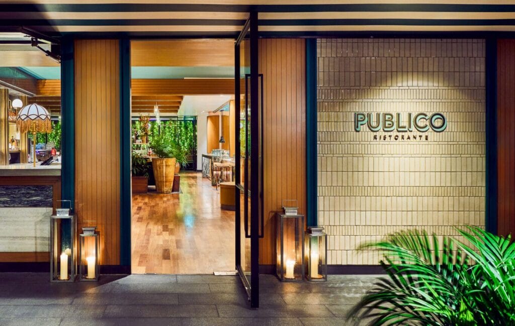  Publico Ristorante front, featuring a door and the Publico Ristorante signage on the feature wall