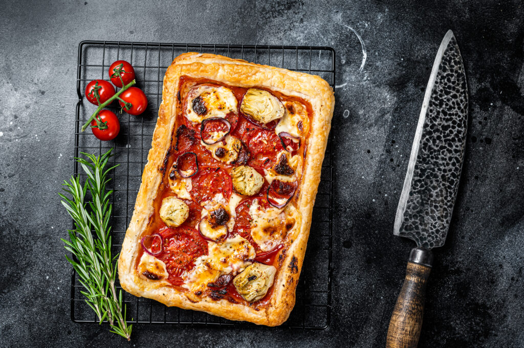 Roman (Al Taglio) Pizza on a tray ready to be cut for delivery in Singapor